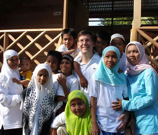 James Jay Dudley Luce with children the foundation serves